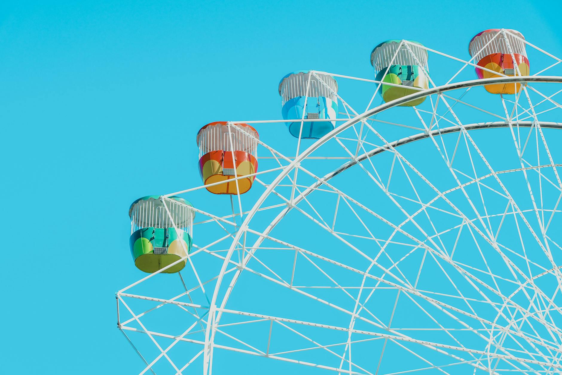 colorful ferris wheel against clear blue sky